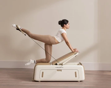 Woman exercising on a Movaped adjustable weight bench for home strength training 