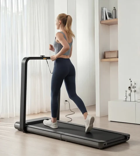 Woman running on the Movaped X21 foldable treadmill during an indoor workout
