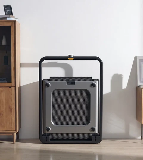 Movaped X21 foldable treadmill stored upright using the signature vertical fold design

