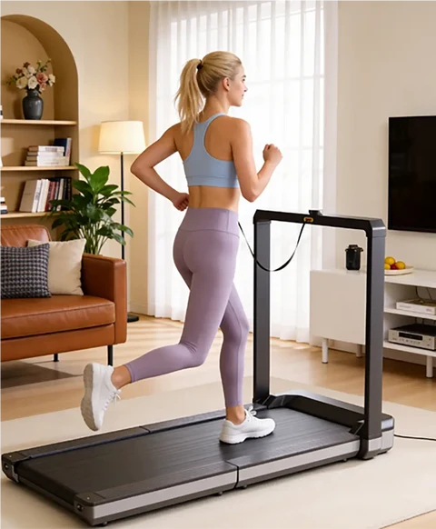 Woman running on the Movaped X25 foldable treadmill during an indoor workout
